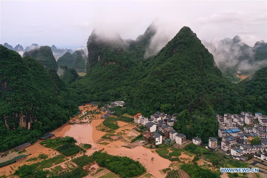 Click to enlarge Aerial photo taken on June 7, 2020 shows a village hit by flood caused by downpour in Yangshuo of Guilin, south China's Guangxi Zhuang Autonomous Region.