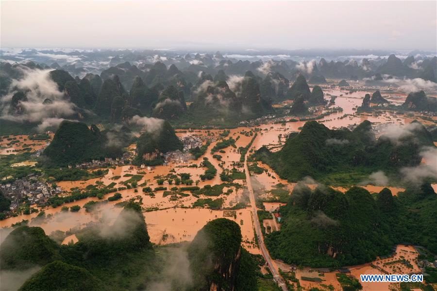Click to enlarge Aerial photo taken on June 7, 2020 shows a village hit by flood caused by downpour in Yangshuo of Guilin, south China's Guangxi Zhuang Autonomous Region.