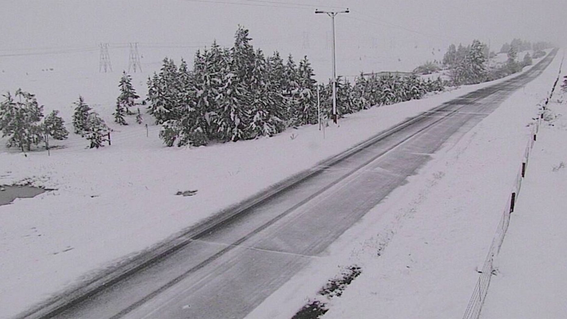 Snow falls along Interstate 15 near Elk Park, Montana on June 8, 2020