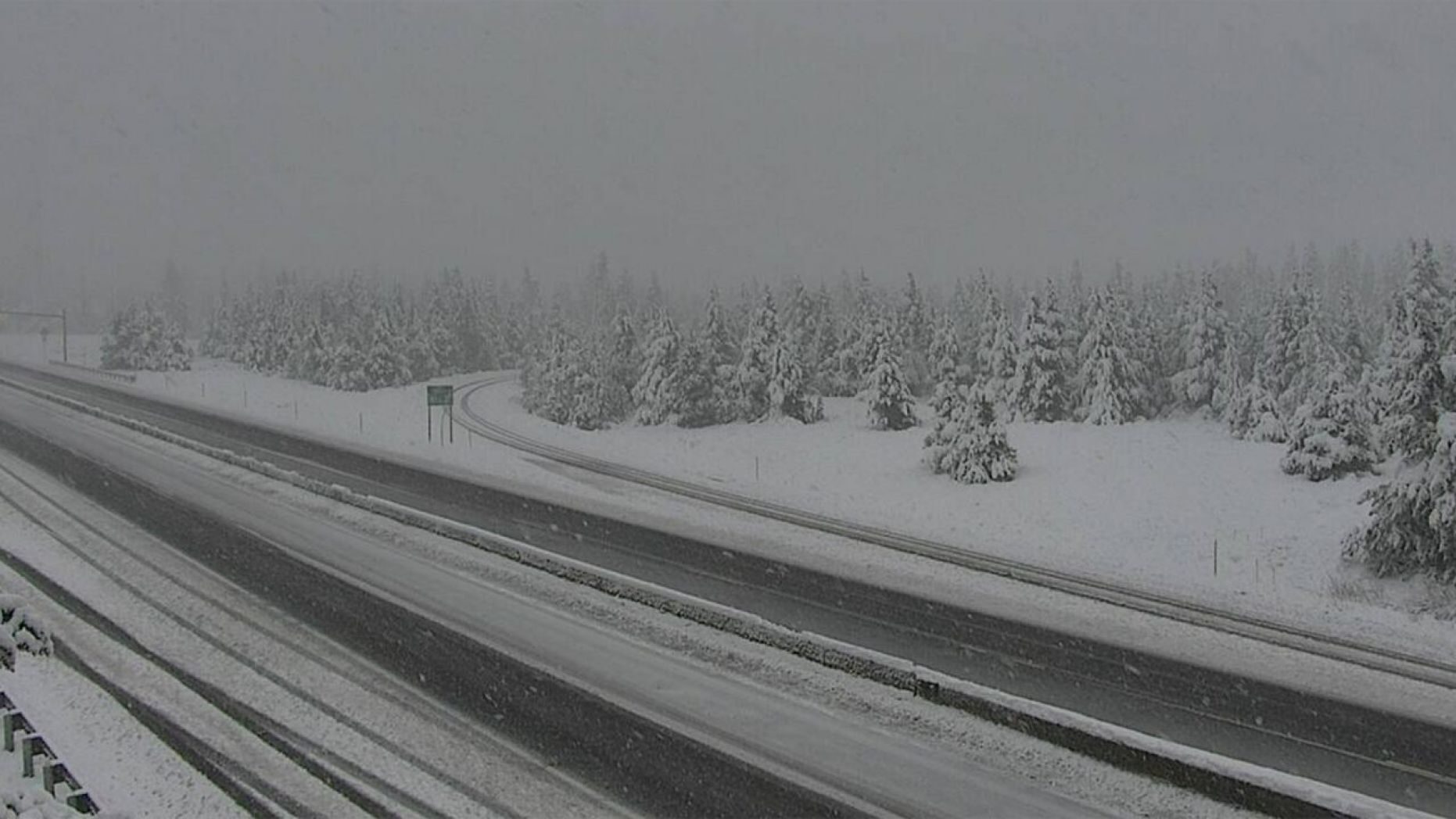 Snow falls in Homestake Pass on Interstate 90 in Montana on June 8, 2020.