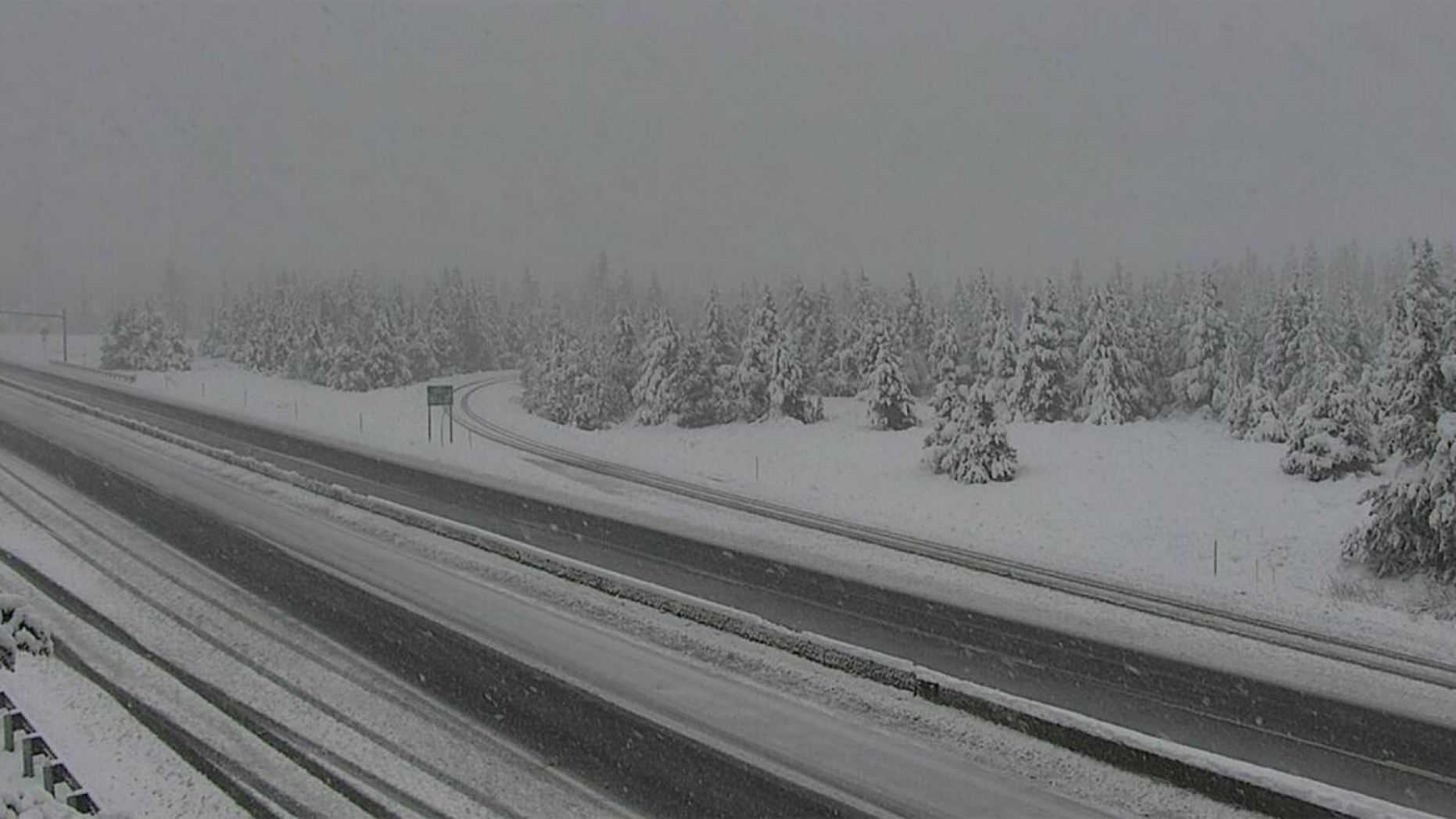Click to enlarge Snow falls in Homestake Pass on Interstate 90 in Montana on June 8, 2020.