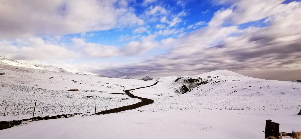 An aerial view of the Siban Grassland after snowfall.