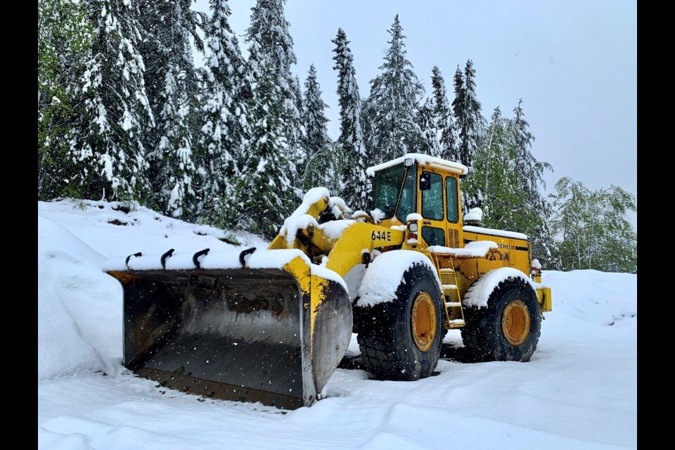 Click to enlarge Snowplows and loaders had to be brought out to clear municipal streets