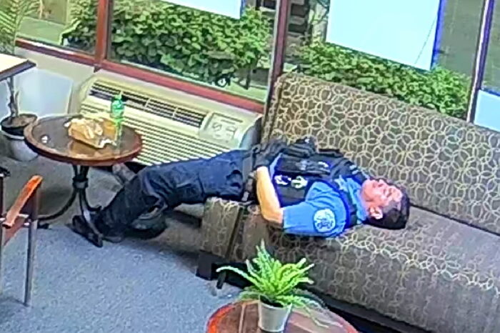 Click to enlarge sleeping police officer during chicago riots