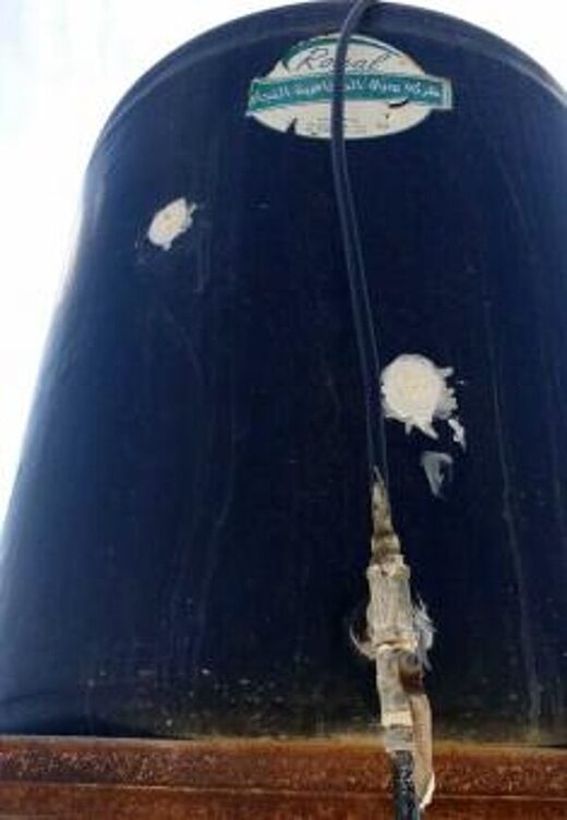 Click to enlarge palestine water tank bullet holes