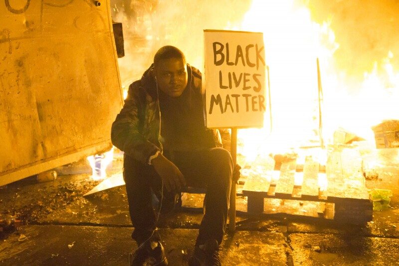 man with Black Lives Matter sign