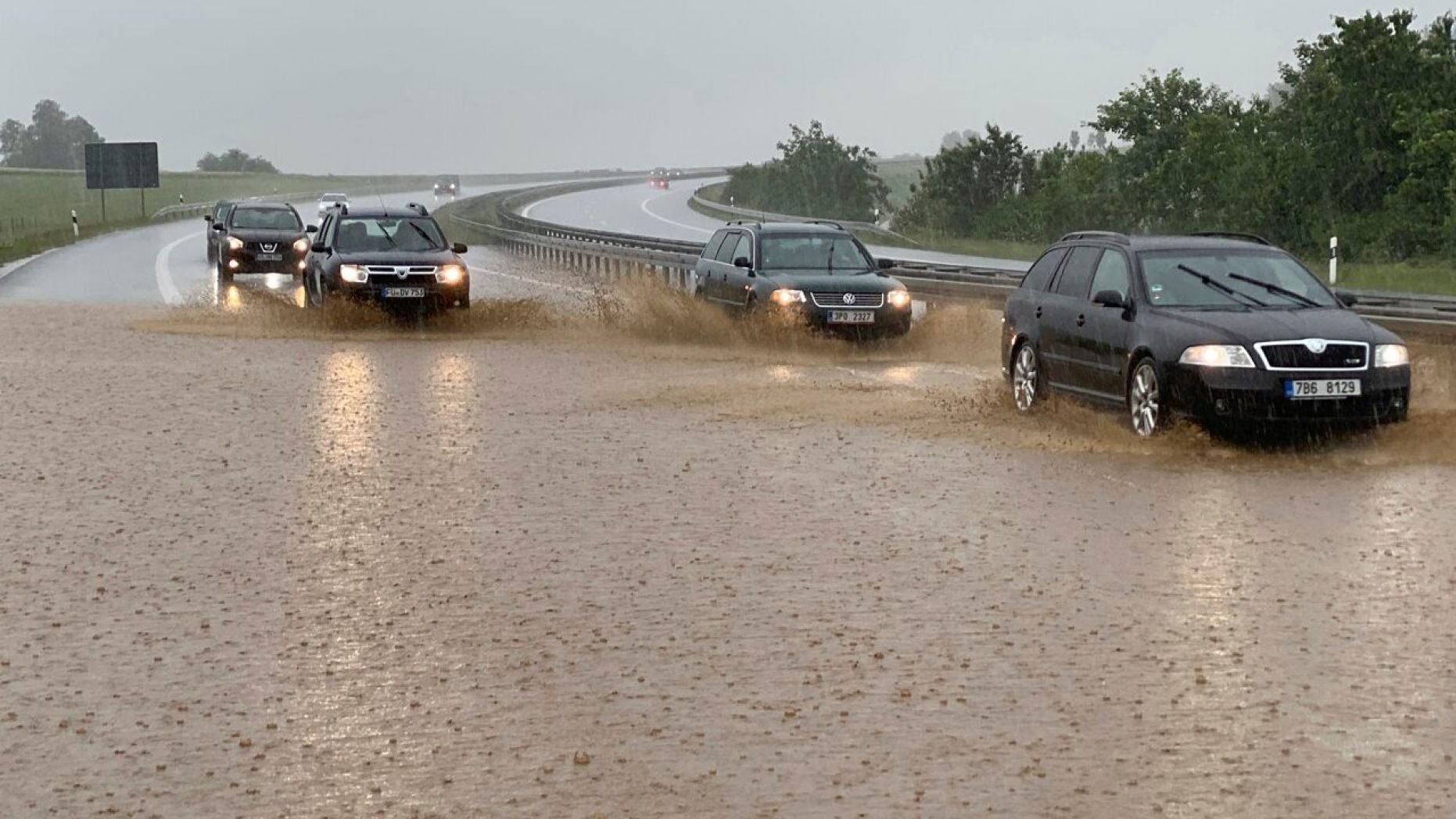 Cars drive in heavy rain on the partially flooded Autobahn in Wieselrieth, Germany, June 14. Heavy storms over the weekend caused numerous floods in the district of Neustadt an der Waldnaab.