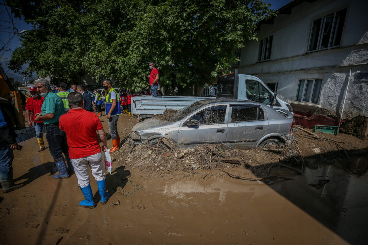 Damaged buildings and vehicles are