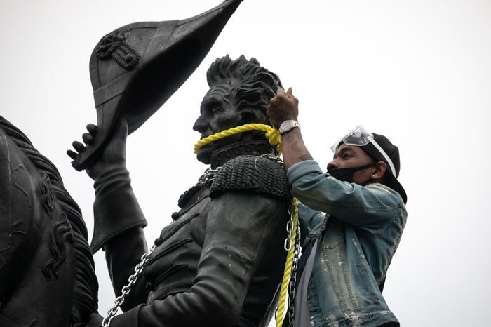 protester removing statue Andrew Jackson
