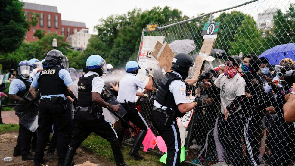 Police officers clash with protesters