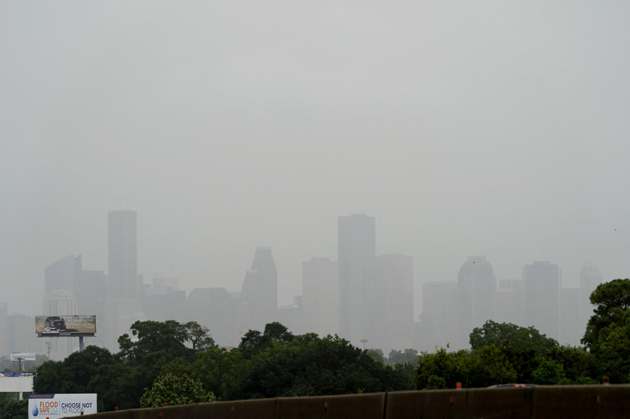Downtown Houston is cloaked in haze as a Saharan dust cloud moves over parts of Texas on Friday, June 26, 2020.