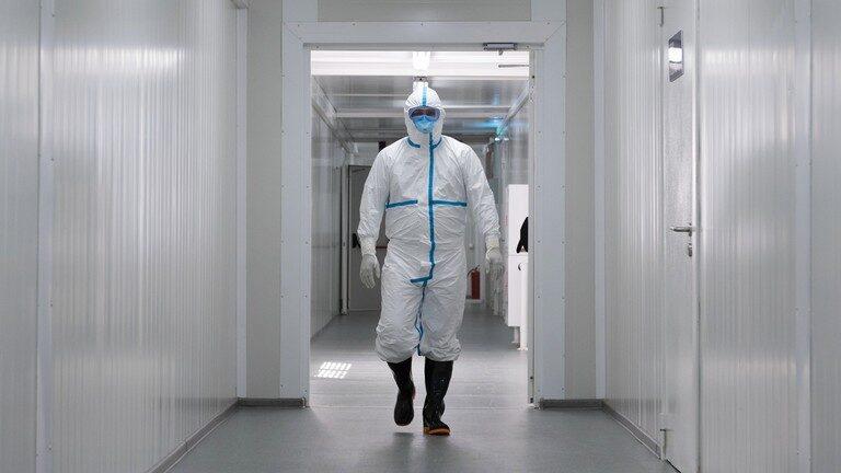 Click to enlarge lab worker