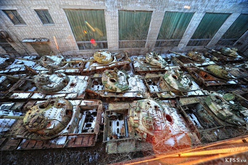 Click to enlarge rusting soviet tanks abandoned