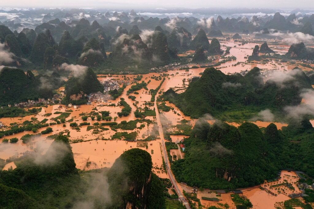 Floodwaters surrounding a village in the Guangxi region of southern China, in a photo released last month by Xinhua, a state-run news agency