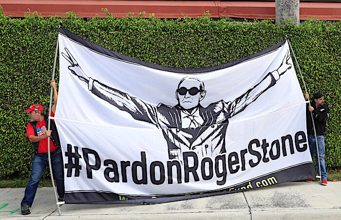 Click to enlarge 2 guys with Roger Stone banner