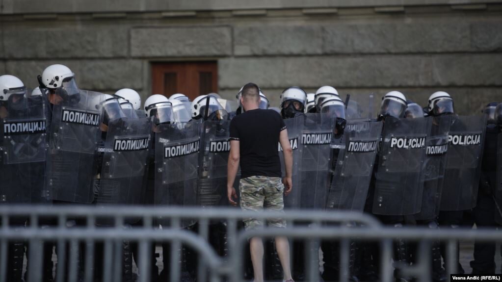 Click to enlarge protester faces police Belgrade Serbia
