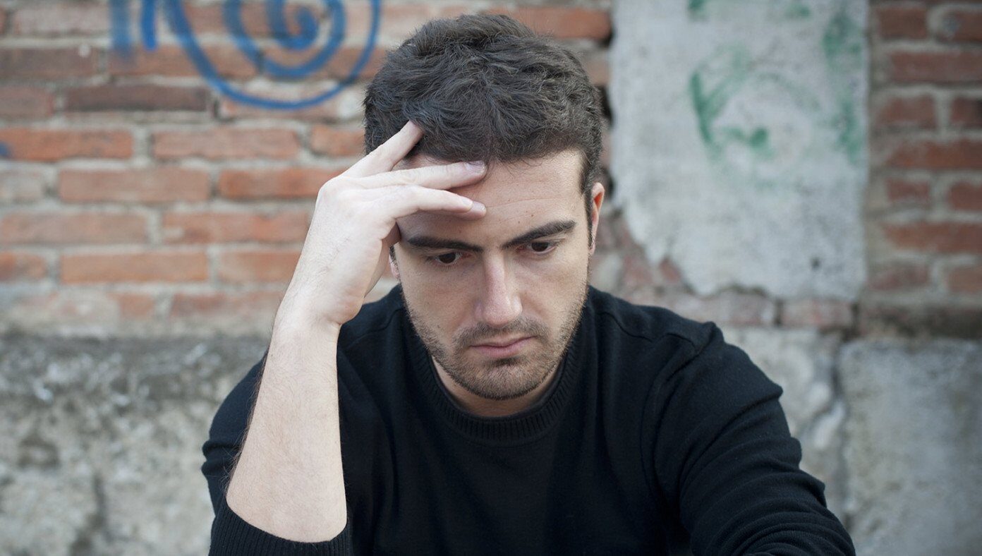 guy with hand on head