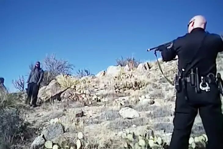 Click to enlarge police perp gunpoint