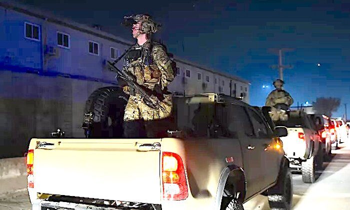 Soldiers in trucks