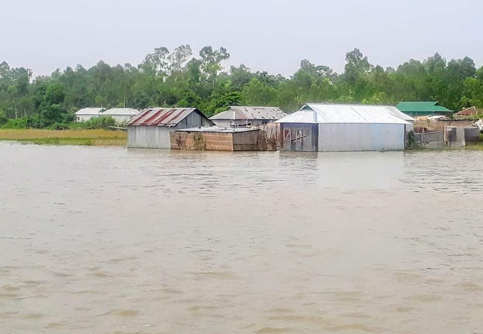 Floodwater reached houses in Rulipara village under Gabsara union of Tangail's Bhuapur upazila on Tuesday, July 14, 2020
