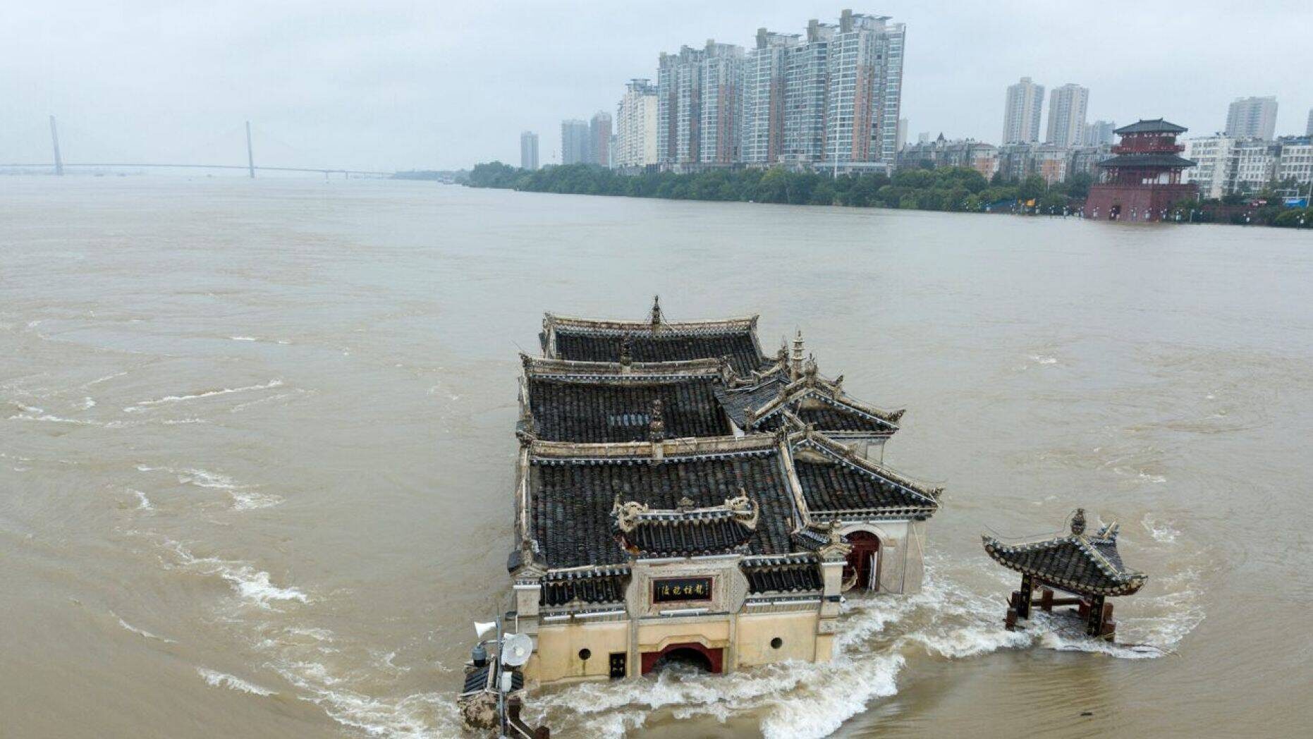 The Kwanyin temple built on a rocky island in the middle of the Yangtze River is seen flooded as the water level surge along Ezhou in central China's Hubei province