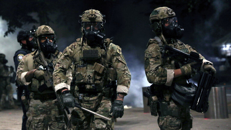 Click to enlarge Federal law enforcement officers