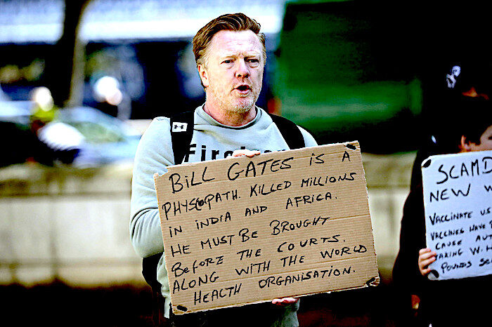 Click to enlarge Man w BillGates sign