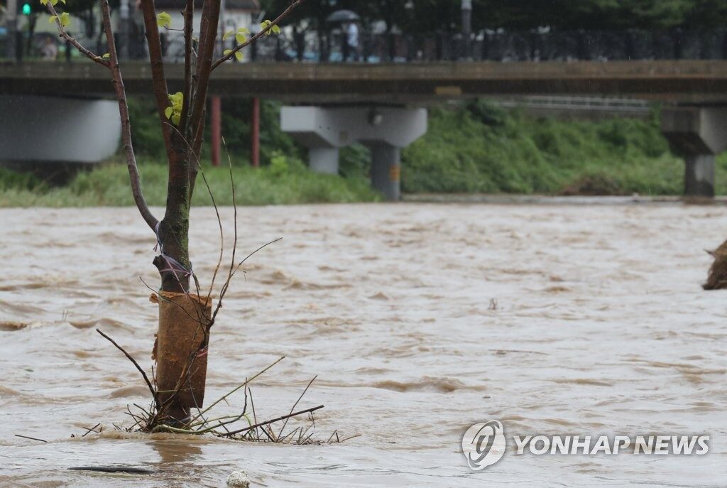 A parking lot is submerged by an overflowing