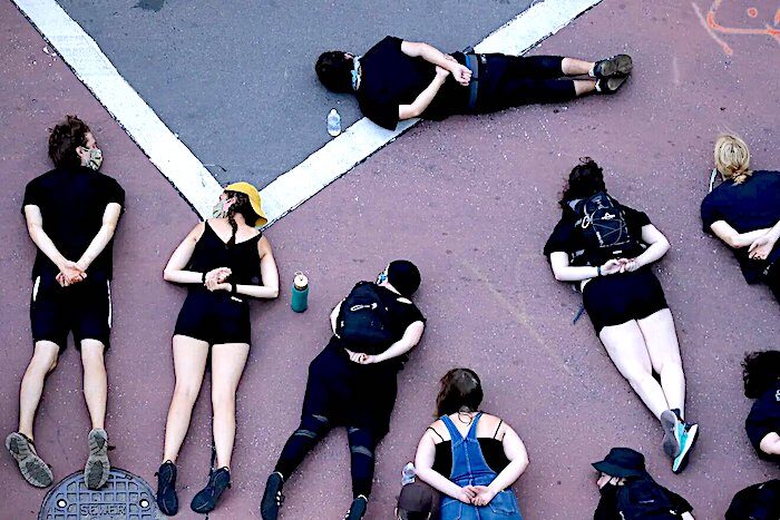 Click to enlarge protesters lay in street