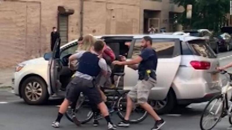 Click to enlarge New York police officers force protester into unmarked van, video shows: 'NYC is taking after Portland'