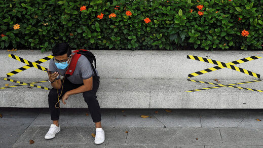 man sitting on bench, facemask, social distancing