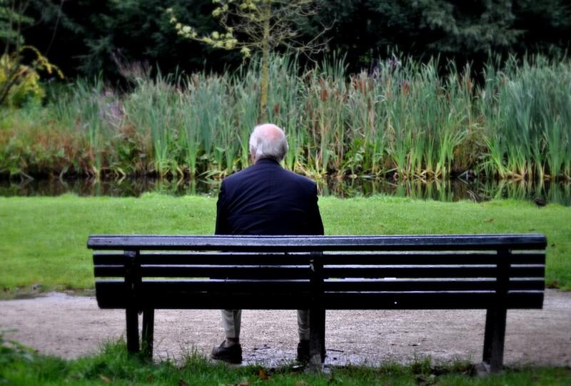 old man on bench loneliness alzheimer's