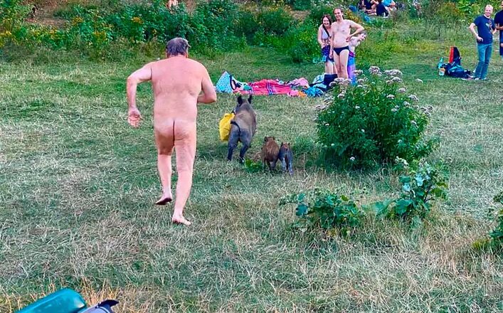 Click to enlarge man after boar