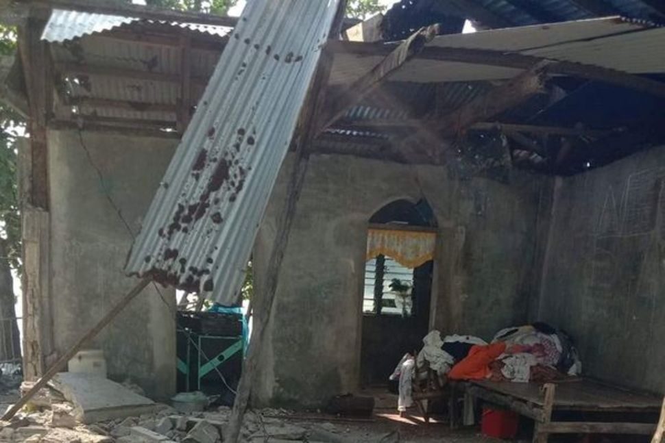Click to enlarge A partially damaged building is seen amid debris in Masbate Province, August 18, 2020, after an earthquake struck the Philippines.