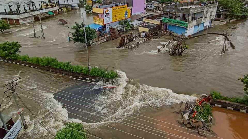 Flooded streets and submerged houses after heavy rainfall, in Warangal district on Sunday.