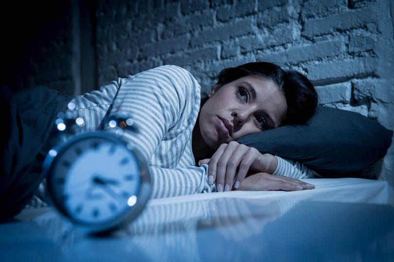 Woman lying awake insomnia