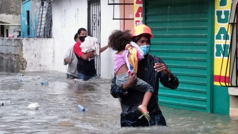 Volunteers from Dominican Republic Red Cross carry out evacuations after floods from Tropical Storm Laura, August 2020.