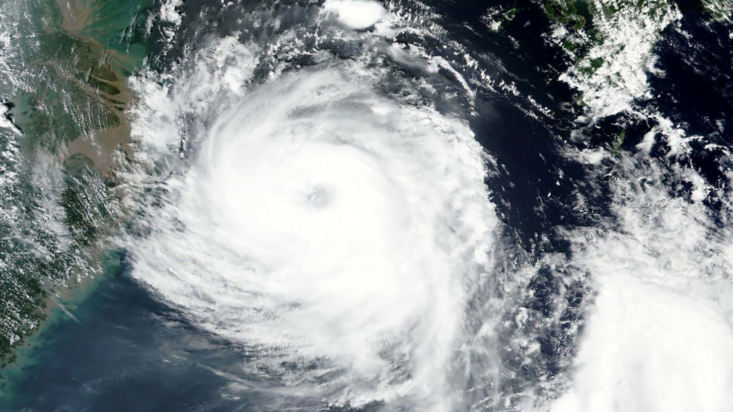 Satellite image released by NASA shows Typhoon Bavi near South Korean island of Jeju on Tuesday.
