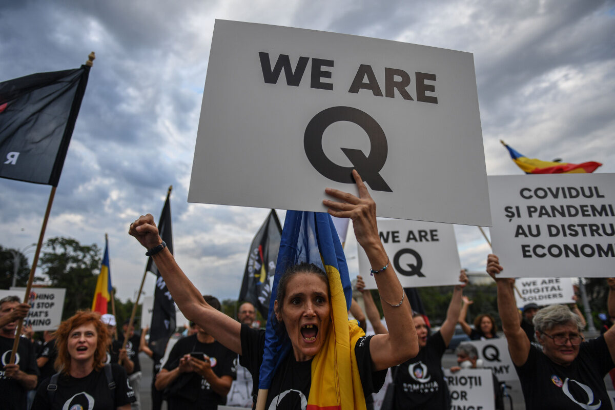 Click to enlarge A woman shouts during a protest against coronavirus measures