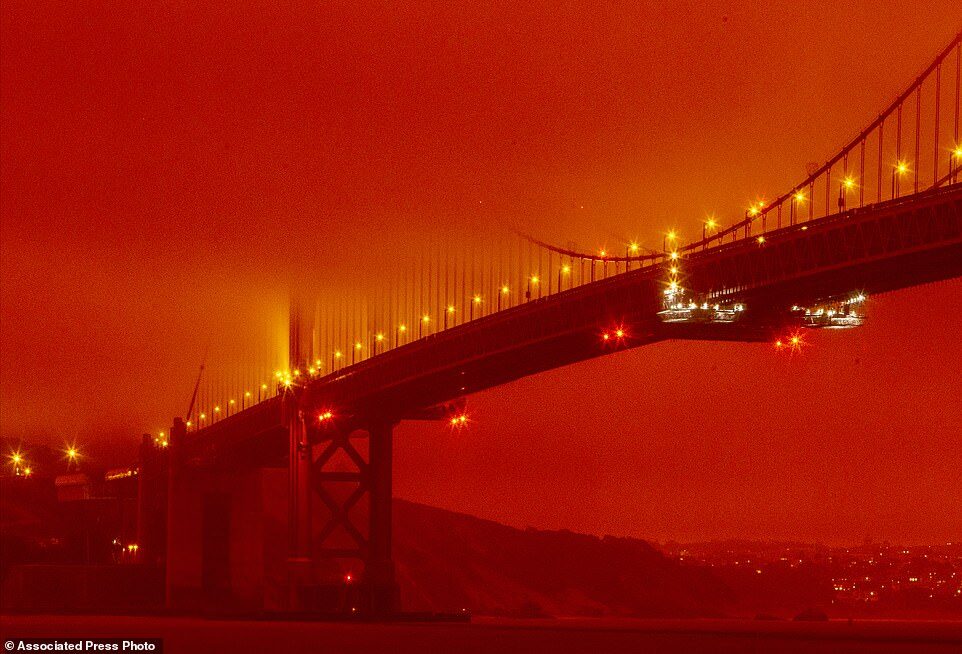 Click to enlarge In this photo provided by Frederic Larson, the Golden Gate Bridge is seen at 11am Wednesday morning in San Francisco, amid a smoky, orange hue caused by the ongoing wildfires