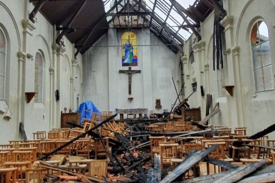 Click to enlarge arson damage in church