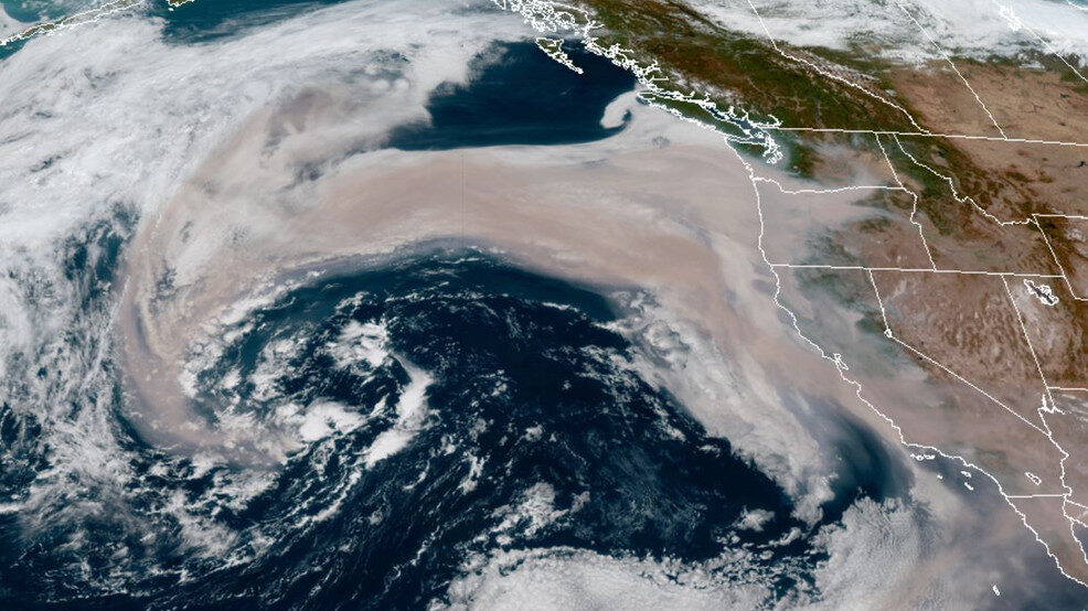 Click to enlarge A swath of wildfire smoke is getting pulled into an offshore storm