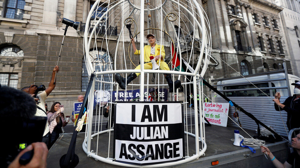 assange protest canary cage london