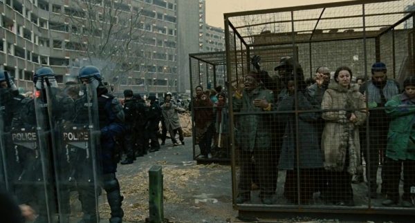 Click to enlarge caged people