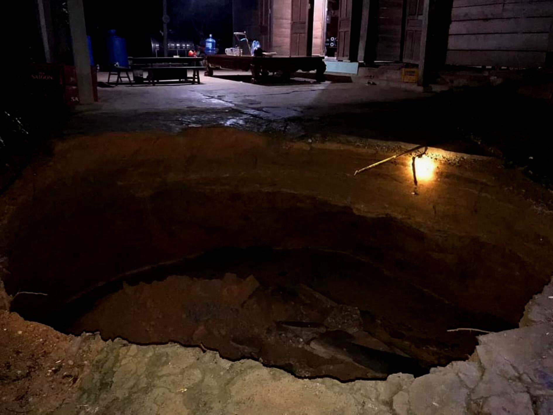Click to enlarge A large sinkhole emerges in the front yard of a house in Quang Binh Province, Vietnam, September 28, 2020.