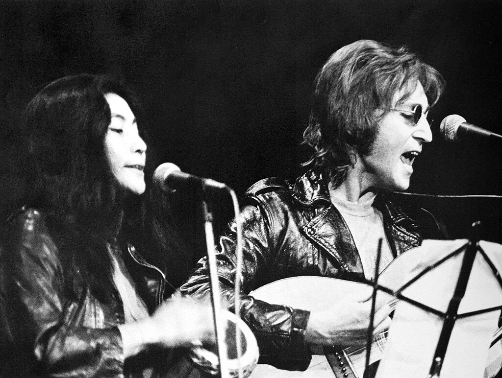 Click to enlarge Lennon and Ono performing at the John Sinclair Freedom Rally in December 1971