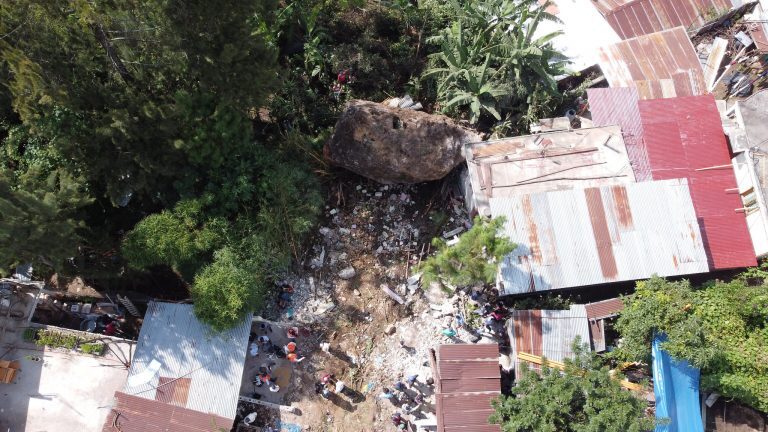 A huge boulder fell onto houses after a landslide