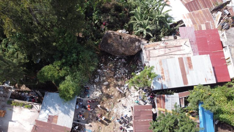A huge boulder fell onto houses after a landslide