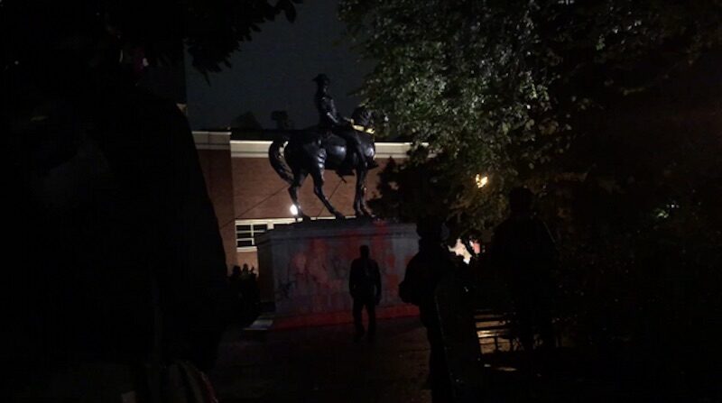A group of protesters tore down the 