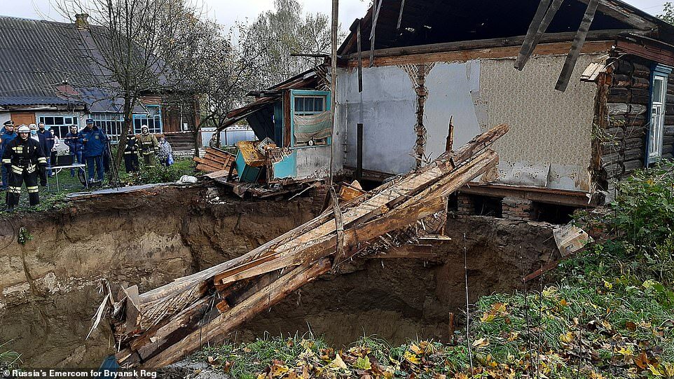 Cranes and special teams have been brought in to assist with clearing debris left by the ruined house in the Russian village of Vyshkov